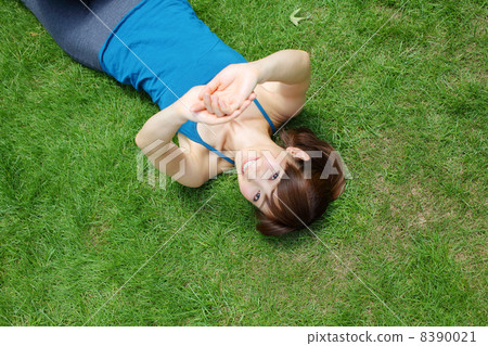 Lady lying on the lawn 8390021