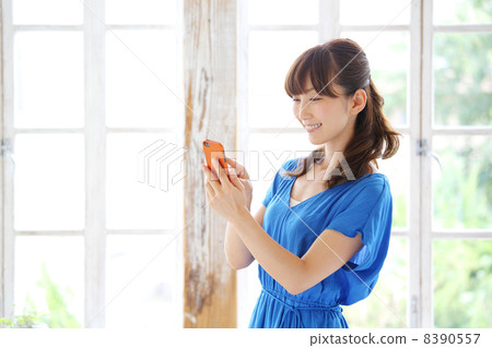 Woman using a smartphone 8390557
