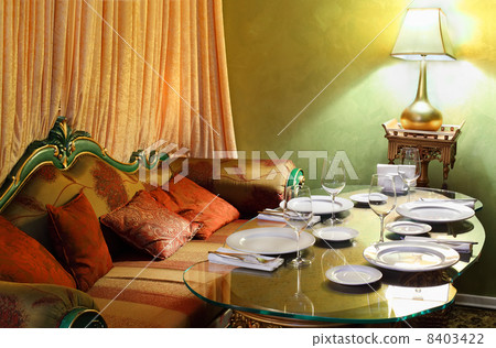 beautiful glass table with serving, lamp and sofa in eastern lux 8403422