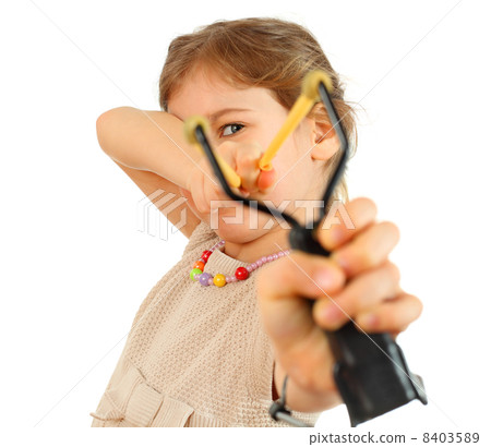 Girl with slingshot aim to camera isolated on white background Girl with slingshot aim to camera isolated on white background 8403589