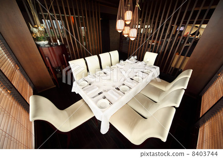 beautiful table with white tablecloth and serving and ten white 8403744