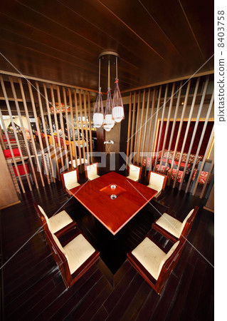 square table in deepening of floor and chairs in empty cozy rest 8403758