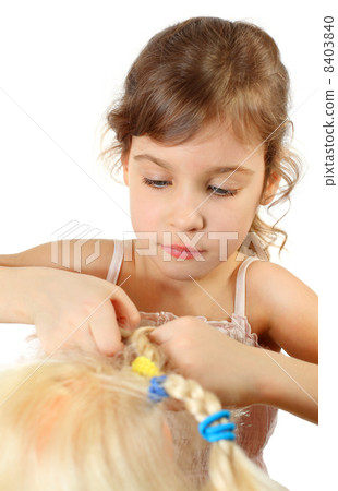 Little beautiful girl braids doll hair isolated on white backgro 8403840