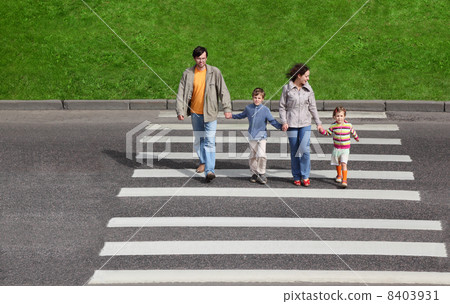 mother and father holds hand of little daughter and son and cros mother and father holds hand of little daughter and son and cros 8403931