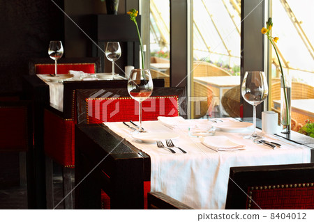 beautiful serving at tables with white tablecloth and red chairs 8404012