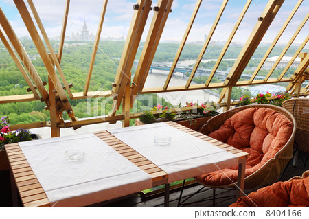 Wicker chairs and table at terrace in empty stylish restaurant; 8404166