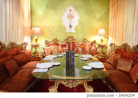 beautiful glass table with serving and red sofas in eastern luxu beautiful glass table with serving and red sofas in eastern luxu 8404204
