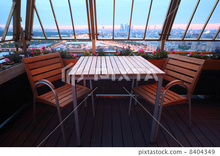 Wooden chairs and table at terrace in empty restaurant; panorama 8404349