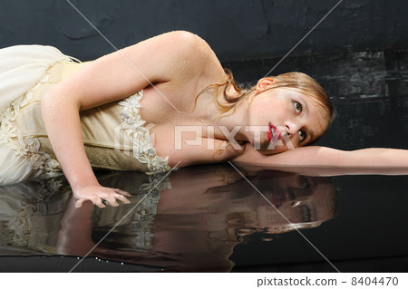 beautifu thoughtfull girl wearing in dress with corset lies on w beautifu thoughtfull girl wearing in dress with corset lies on w 8404470