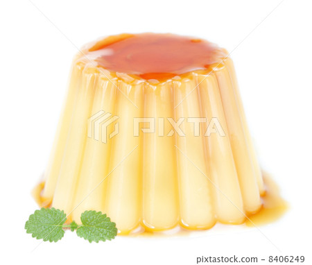 Delicious pudding with caramel and mint leaves. On a white backg Delicious pudding with caramel and mint leaves. On a white backg 8406249