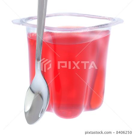 Red gelatin in a plastic bag with a spoon. On a white background Red gelatin in a plastic bag with a spoon. On a white background 8406250