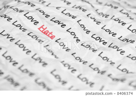 The word hate, love written on a crumpled piece of closeup. 8406374