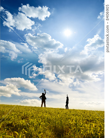 Two men who stand on the meadow 8406905