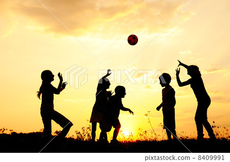Silhouette, group of happy children playing on meadow, sunset, summertime Silhouette, group of happy children playing on meadow, sunset, summertime 8409991