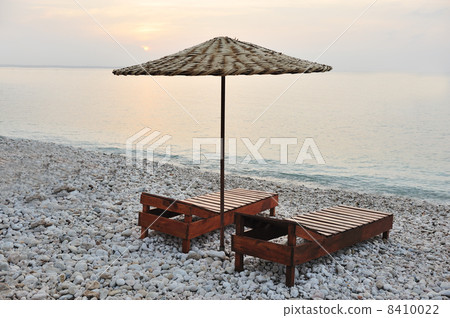two chairs and umbrella on the beach two chairs and umbrella on the beach 8410022