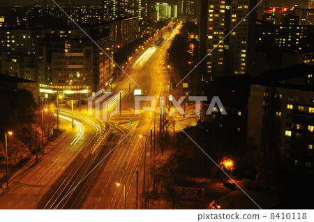 Modern Urban City at Night with Freeway Traffic Modern Urban City at Night with Freeway Traffic 8410118