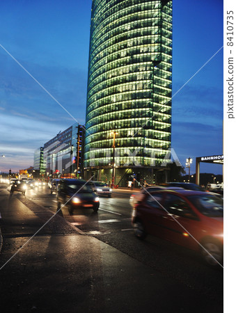 Cars motion on street in the downtown at night (blurred scene) 8410735