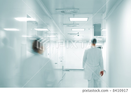 Working people with white uniforms walking in modern factory environment 8410917