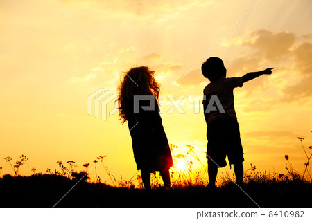 Silhouette, group of happy children playing on meadow, sunset, summertime Silhouette, group of happy children playing on meadow, sunset, summertime 8410982