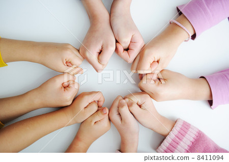 Picture of hands to stay together over the table to show solidarity 8411094