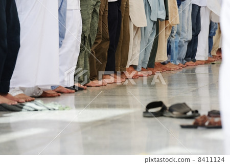 Muslims praying together at Holy mosque Muslims praying together at Holy mosque 8411124