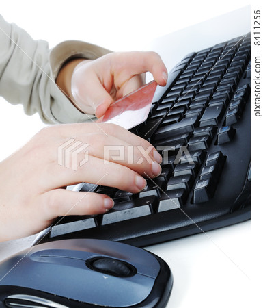 Female hands typing on credit card 8411256
