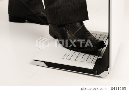 Business foot walk over laptop with white background 8411265