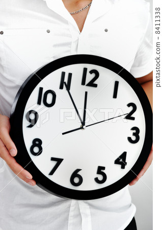 Image of a person holding a watch in his hands 8411338