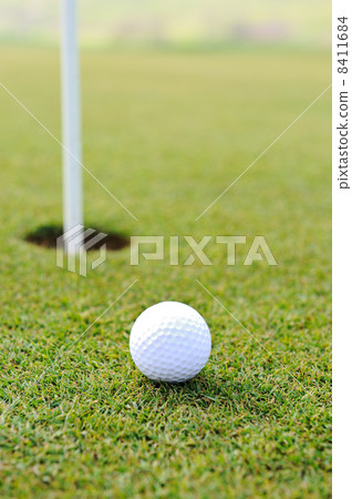 Ball and hole on golf field Ball and hole on golf field 8411684