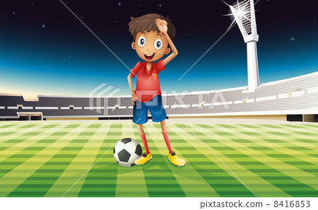 A boy with a soccer ball standing in the soccer field 8416853