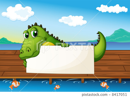 An alligator holding an empty signboard at the lake with fish An alligator holding an empty signboard at the lake with fish 8417051