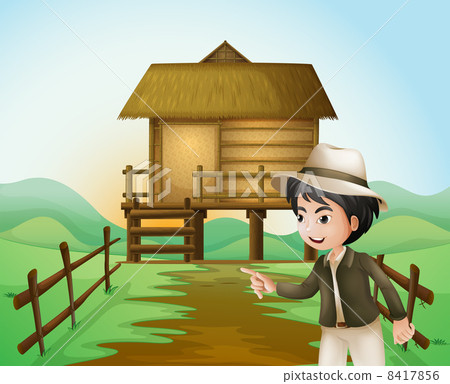 A boy with a hat standing near the nipa hut A boy with a hat standing near the nipa hut 8417856