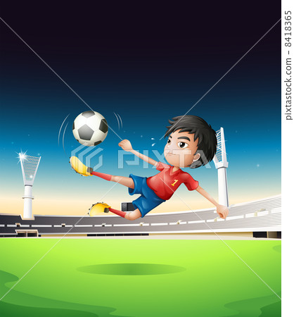 A boy in a red uniform at the soccer field A boy in a red uniform at the soccer field 8418365