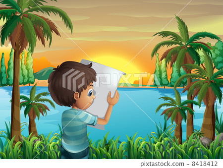 A boy with a paper at the riverbank 8418412