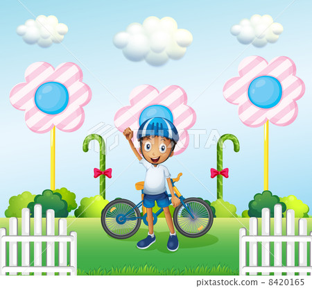 A happy boy at the candyland with his bike A happy boy at the candyland with his bike 8420165