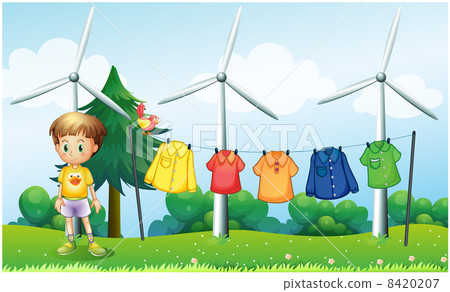 Hanging clothes at the hill near the windmills Hanging clothes at the hill near the windmills 8420207