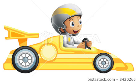 A boy riding in a yellow racing car A boy riding in a yellow racing car 8420265