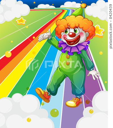 A clown standing in the colorful road A clown standing in the colorful road 8420439