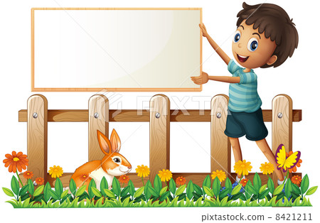 A boy holding a framed board in the garden A boy holding a framed board in the garden 8421211