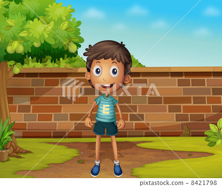 Boy standing in the yard Boy standing in the yard 8421798