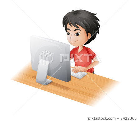 A young boy using the computer A young boy using the computer 8422365
