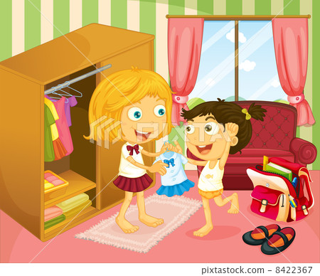 A girl helping her sister with her uniform A girl helping her sister with her uniform 8422367