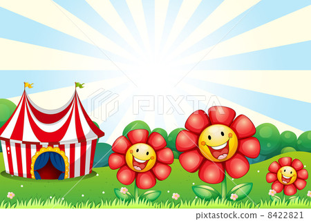 Three plastic flowers and a tent at the top of the hill 8422821