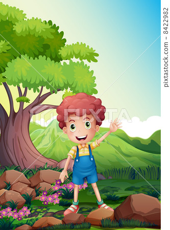 A happy boy waving near the rocks 8422982