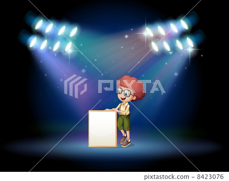 A boy holding an empty frame on the stage with spotlights 8423076