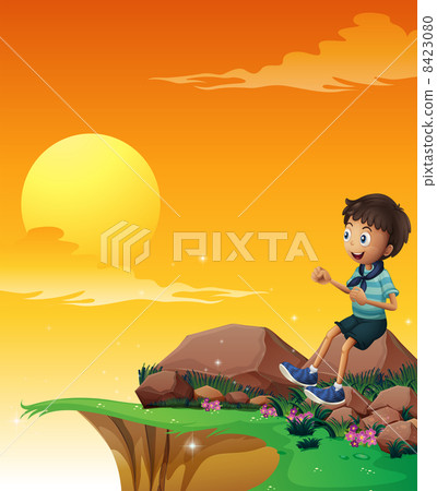 A happy boy sitting at the big rock near the cliff 8423080