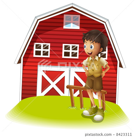 A boy standing in front of the red barnhouse A boy standing in front of the red barnhouse 8423311