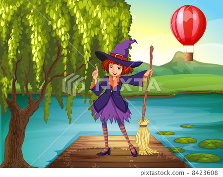 A witch holding a broom standing at the port A witch holding a broom standing at the port 8423608