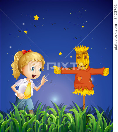 A young girl beside the scarecrow 8423701