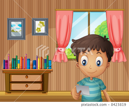 A boy reading a small paper inside the house A boy reading a small paper inside the house 8423819